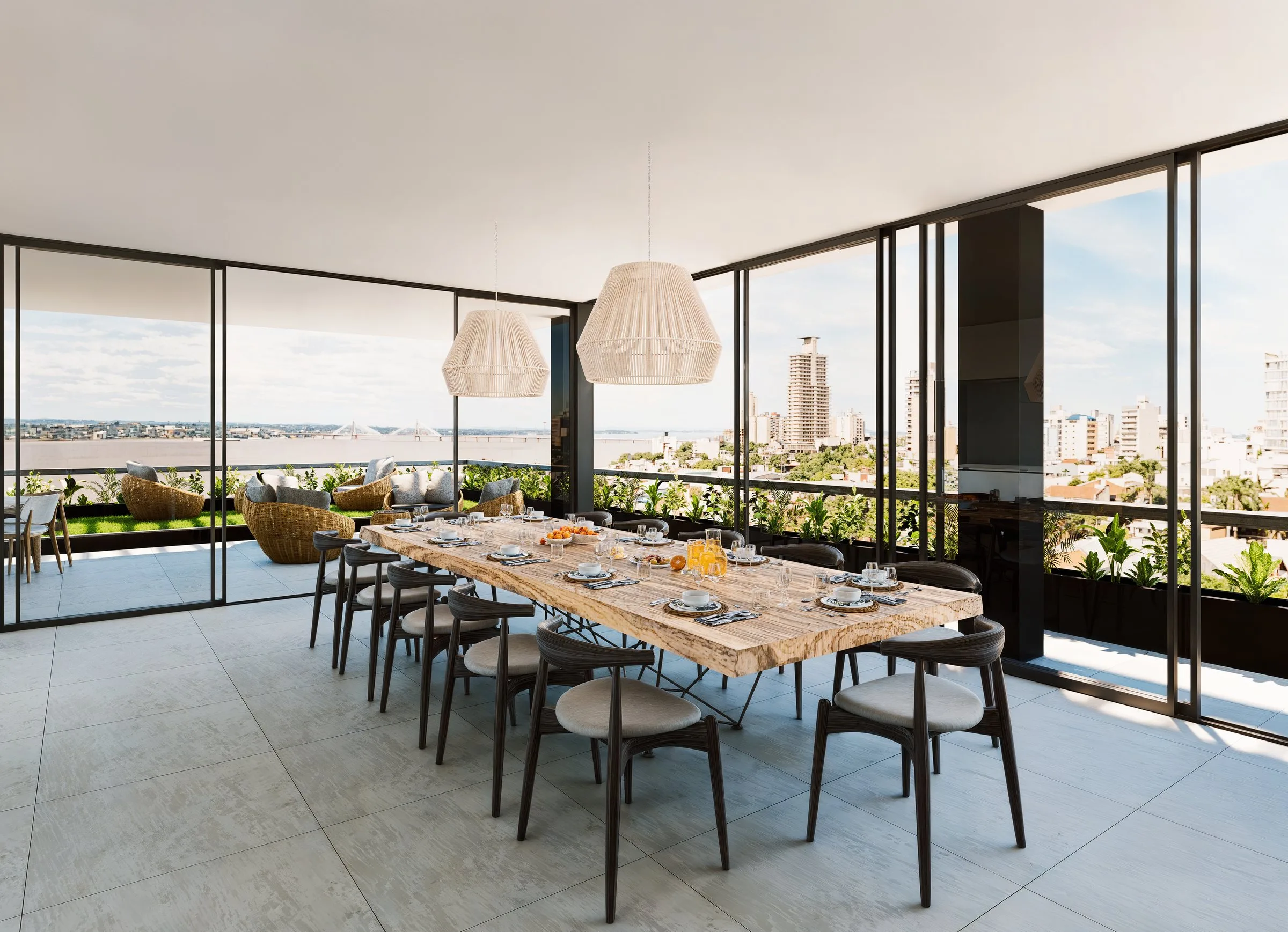 Terraza SUM con mesa comunitaria y vista al río